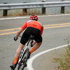 Cyclist wearing linear sock in orange color