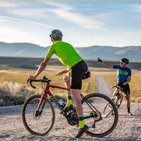 Gravel cyclist stopping to chat with another cyclist about where they will ride to next in Owens Valley California