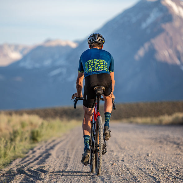 gravel cyclist wearing linear sock in baltic blue 