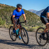 Female gravel cyclist following the wheel of another rider in Owens Valley Ca. 